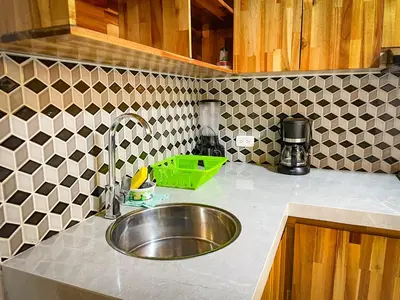 a kitchen counter with a sink in a kitchen at Glen Apt de 2 alcobas Mejor zona medellin in Medellín