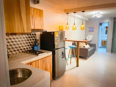 a kitchen with a stainless steel refrigerator and a sink at Glen Apt de 2 alcobas Mejor zona medellin in Medellín