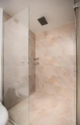 a shower with a glass door in a bathroom at Elegante Apto en el Poblado! Vista Fabulosa in Medellín