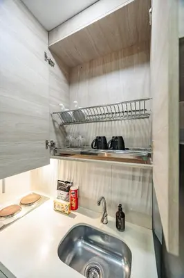 a kitchen with a sink and a counter top at One Apartments Laureles in Medellín