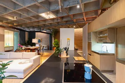 a living room with a couch and a table at Soho Lofts by Vibra Bonita in Medellín