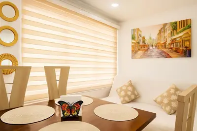 a dining room with a table with a butterfly on it at Apto 201 Sweet Home Medellín in Medellín