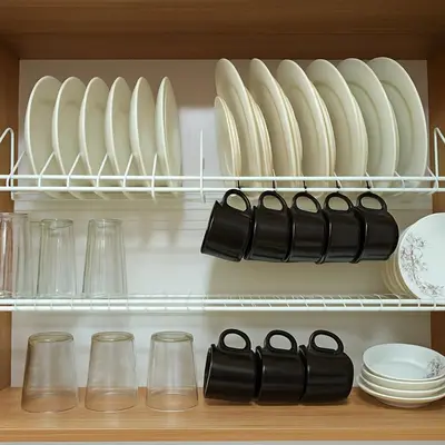 a cupboard with plates and dishes on a shelf at Apto 201 Sweet Home Medellín in Medellín