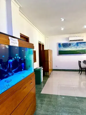 a room with a large fish tank in a room at Hotel Prince Plaza - Laureles Estadio in Medellín