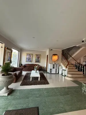 a living room with a couch and a table at Hotel Prince Plaza - Laureles Estadio in Medellín