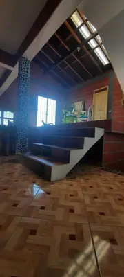 a room with a table in the middle of a room at Casa Hotel los Patios in Jericó