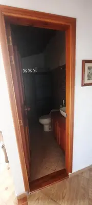 a bathroom with a sink and a toilet in it at Casa Hotel los Patios in Jericó