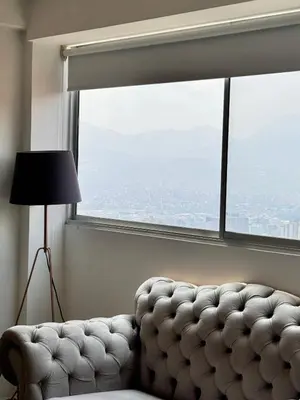 a living room with a couch and a large window at 2511 Suite Moderna y de lujo con la mejor vista a la ciudad - Poblado Medellín in Medellín