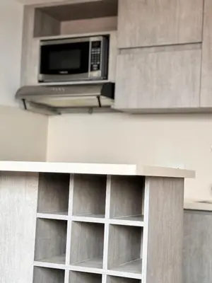a microwave oven sitting on top of a counter at 2511 Suite Moderna y de lujo con la mejor vista a la ciudad - Poblado Medellín in Medellín