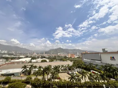 a view of a city with palm trees and buildings at Class 48, Sabaneta in Sabaneta