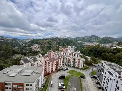 an aerial view of a city with buildings at Acogedor apto 2 habitaciones in Manizales