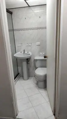 a bathroom with a toilet and a sink at Hab. Cama doble y baño privado #3 in Medellín