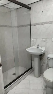 a bathroom with a shower and a sink and a toilet at Hab. Cama doble y baño privado #3 in Medellín