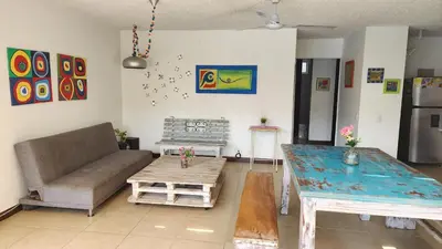 a living room with a couch and a table at Apartasol Santa Fe de Antioquia - Ciudadela Santa Fe in Santa Fe de Antioquia