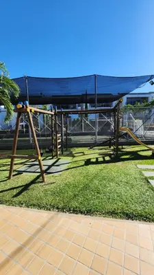 a park with a swing set in the grass at Apartasol Santa Fe de Antioquia - Ciudadela Santa Fe in Santa Fe de Antioquia
