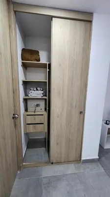 an open door to a room with a closet at Apartamentos Borbon Suites in Medellín