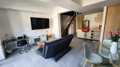 a living room with a couch and a glass table at Apartamentos Borbon Suites in Medellín