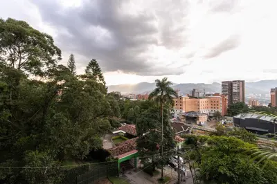 a view of a city with trees and buildings at Apartamentos Borbon Suites in Medellín
