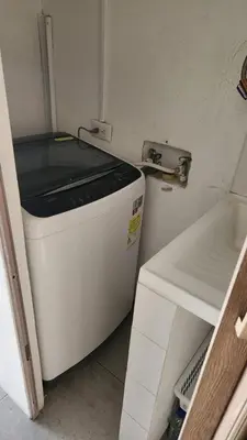 a small white appliance sitting in a room at Apartamentos Borbon Suites in Medellín