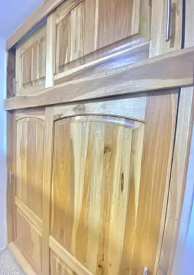a wooden cabinet with glass doors in a room at Hermoso apartamento en zona central de Medellín in Medellín