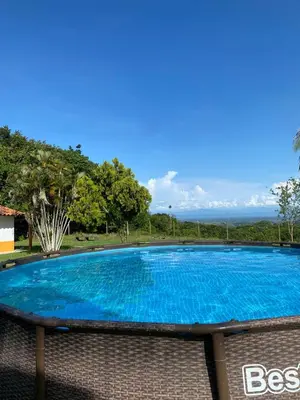 a large blue swimming pool in a yard at Mirador del Magdalena in Doradal