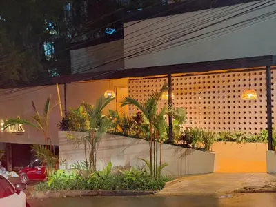 a building with a bunch of plants in front of it at Poblado Muuk Hotel Boutique Campestre in Medellín