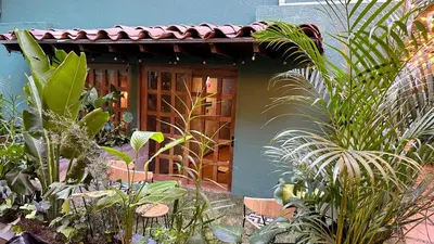 a house with a bunch of plants in front of it at Poblado Muuk Hotel Boutique Campestre in Medellín