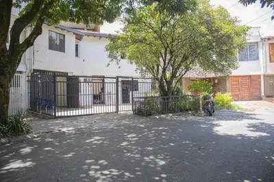 a wrought iron fence in front of a house at Apartamento cómodo, agradable y económico in Medellín