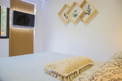 a bedroom with a bed with a pillow on it at Apartamento cómodo, agradable y económico in Medellín