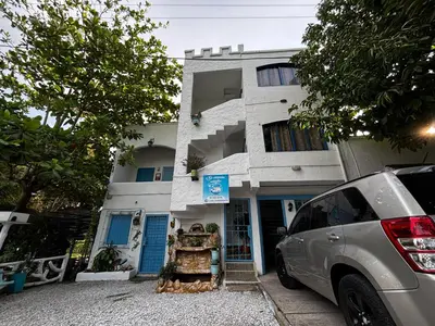 a car parked in front of a building at cabaña 83 Santorini in Puerto Triunfo