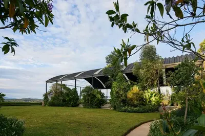 a greenhouse in the middle of a garden at The Brown, Guatape, Autograph Collection in Guatapé