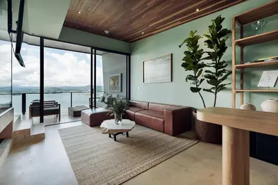 a living room with a couch and a table at The Brown, Guatape, Autograph Collection in Guatapé