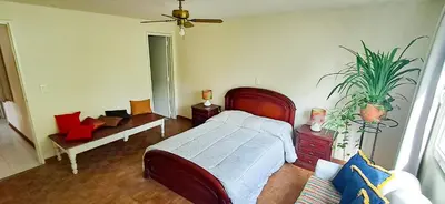 a bedroom with a bed and a couch at Habitación Privada en Apartamento, Conquistadores in Medellín