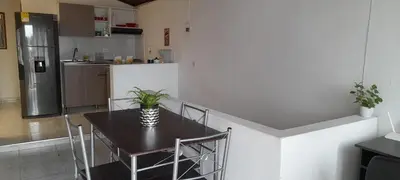 a kitchen with a table and chairs in a room at M76 apartamento acogedor en Medellin in Medellín