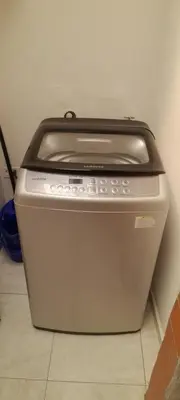 a toaster oven sitting on a floor next to a wall at M76 apartamento acogedor en Medellin in Medellín