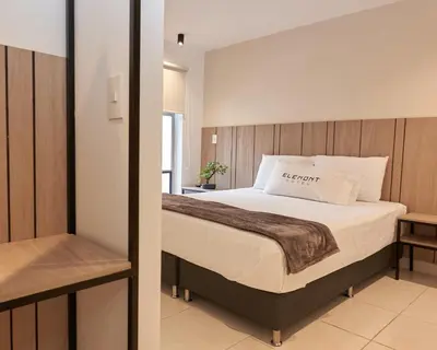 a bedroom with a bed in a room at Elemont Hotel in Medellín