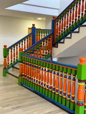 a set of stairs with orange and green at ALTO VERDE HOTEL in Guatapé
