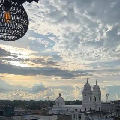 a view of a building with a cloudy sky at Hotel Entre Parques in La Dorada