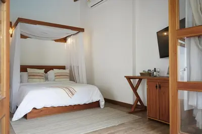 a bedroom with a bed with a canopy at Bio Rio Hotel in San Jerónimo