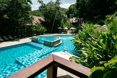 a large swimming pool with a blue tiled at Bio Rio Hotel in San Jerónimo