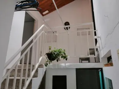 a white staircase with a potted plant on it at casa de relajación lowcost in La Dorada