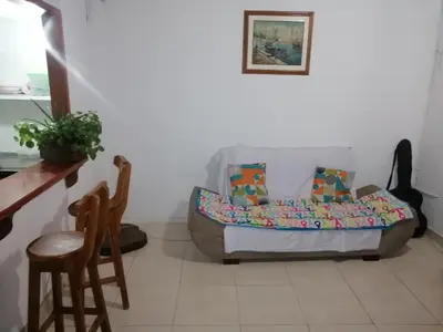 a living room with a couch and a chair at casa de relajación lowcost in La Dorada