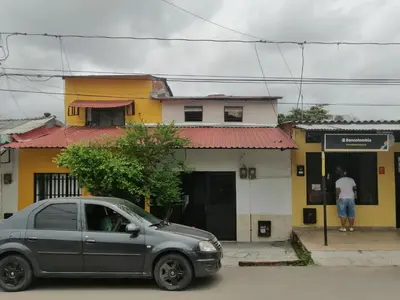 a silver car parked in front of a building at Casa lowcost relajación total! in La Dorada