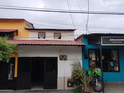 a building with a blue and white at Casa lowcost relajación total! in La Dorada