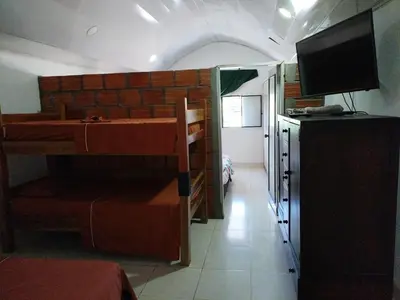 a small room with a kitchen and a room with a kitchen gmaxwell gmaxwell gmaxwell gmaxwell at Casa lowcost relajación total! in La Dorada