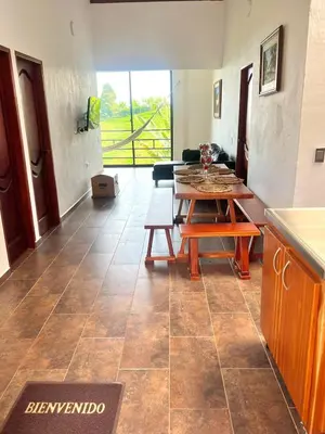 a living room with a table and a couch at Campo Bonito in Jericó