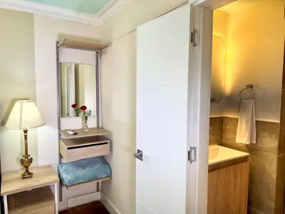 a bathroom with a sink and a mirror at DUO BOUTIQUE HOTEL in Medellín