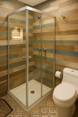a shower stall with a toilet in a bathroom at Two modern furnished apartments in Medellín
