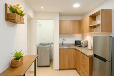 a kitchen with a refrigerator and a sink at Two modern furnished apartments in Medellín