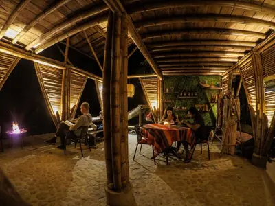 a group of people sitting at a table in a room at Taibará Refugio Natural in San Carlos